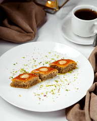 three pieces of azerbaijani pakhlava multi-layered dessert