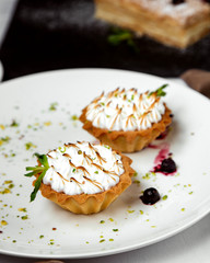 two pieces of tartalete with burned meringue