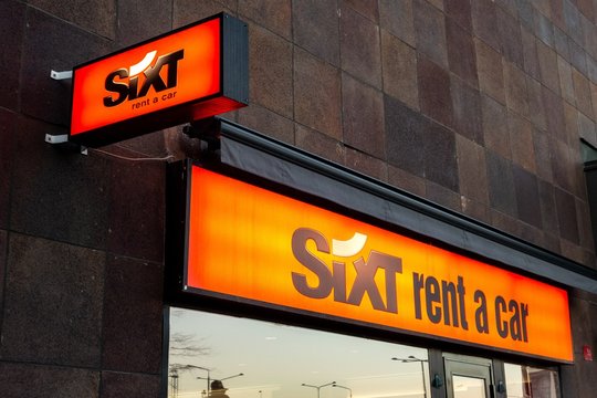 The banner with a logo of the Sixt international car rental company.