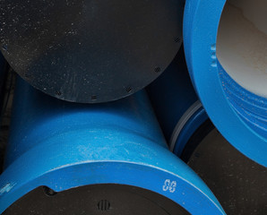 Stack of new blue pipes (tubes)