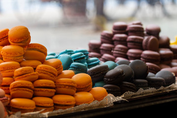 Colorful macarons in showcase, patisserie, sweetshop