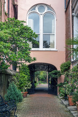 A stone walkway leads to a courtyard in Charleston, South Carolina