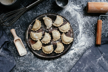 The process of making dumplings, pies in the kitchen © elenavah