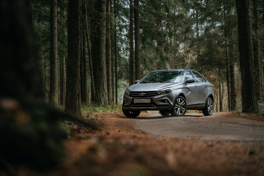 Lada Vesta AMT Robot On Country Road N Autumn Forest