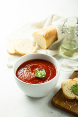 Homemade tomato soup in a white bowl