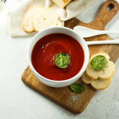 Homemade tomato soup in a white bowl
