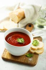 Homemade tomato soup in a white bowl