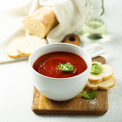 Homemade tomato soup in a white bowl