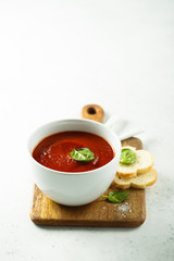 Homemade tomato soup in a white bowl