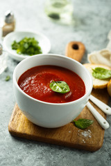 Homemade tomato soup in a white bowl