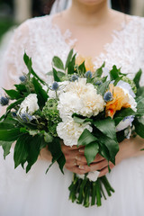 Bride holding a flower bouquet on her wedding day
