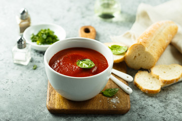 Homemade tomato soup in a white bowl