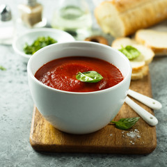 Homemade tomato soup in a white bowl