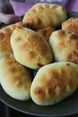 Delicious fresh pies with jam in hand 
