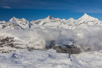 Fototapeta na wymiar Aerial from Gornergrat surrounded by snowcapped mountains.