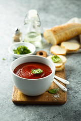 Homemade tomato soup in a white bowl