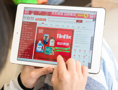 Zhongshan,China-November 11,2015:young woman shopping through ipad on jd.
