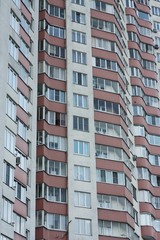 Red white house with windows close up view 