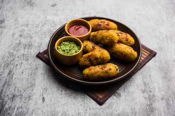 Veg Poha Roll made using flattened Rice, served with tomato ketchup and green chutney