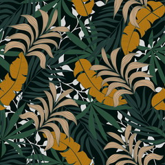 Fashionable seamless tropical pattern with bright orange and green plants and leaves on a green background. Modern abstract design for fabric, paper, interior decor. Beautiful exotic plants. 