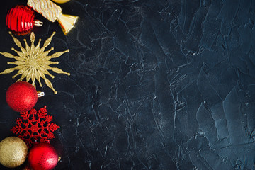 black xmas background, border with red and golden decorations
