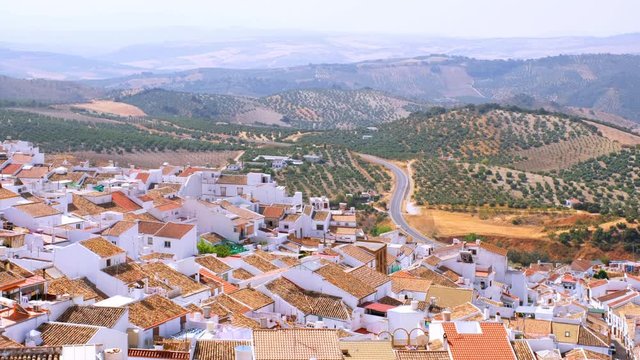 Olvera, Spain. Aerial view of old touristic town Olvera, Spain surrounded by mountains. Dry landscape in hot summer, White houses in Spanish village