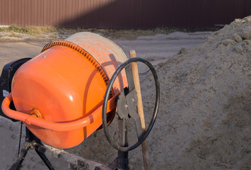 concrete mixer at a construction site. tools.