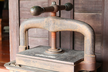 Old rusty heavy mechanic press in retro style.