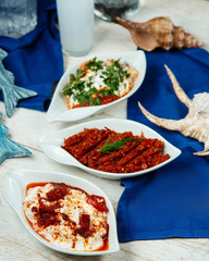spicy turkish side dishes platters served on white table