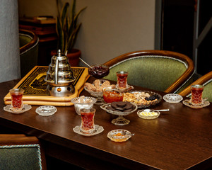 traditional azerbaijani tea setup with jam, dessert and nuts