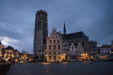 Fototapeta na wymiar Buildings along the Grote Markt and Saint Rumbold's Cathedral in Mechelen, Belgium