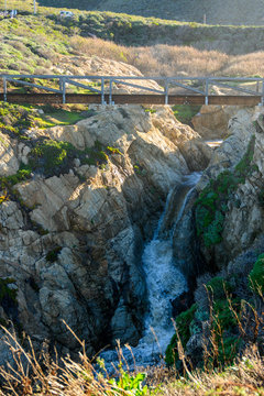 Modern Wooden Bridge Over Waterfall