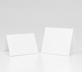 Promotional table talker isolated on white background with clipping path, mockup template paper tri-fold vertical triangle cards with reflections. white sheets front & left and right view. 3d render
