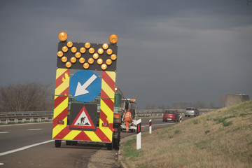 Man at work at highway, near Belgrade town, Serbia