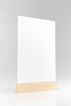 Menu frame standing on wood table isolated on white background with clipping path. space for text marketing promotion Bar restaurant ,Stand for booklets with white sheets of paper. 3d render