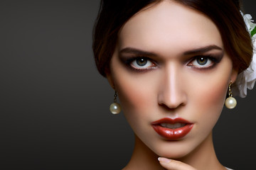 Closeup portrait beautiful girl queen look with red lipstick isolated on dark background