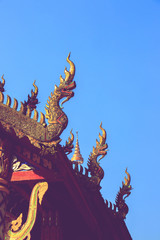 Fototapeta na wymiar Phaya Naga or serpent on gable apex of church is Thai architectural elements of Buddhism.