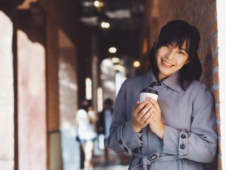 young woman drinking coffee in cafe