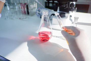 Cropped shot view of  the equipment and science experiments in Laboratory, Chemical substances for research and analyzing a sample under the microscope in laboratory.   