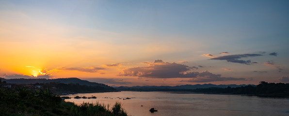  The Sun is falling behind the mountain view beautiful river