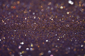 Beautiful Abstract Sparkle Glitter Lights Background.  Gold Champagne, dark deep blue violet gray. Shine Bokeh Effect. For party, holidays, celebration.