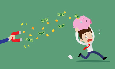 Businessman carrying a piggy bank and running away from hand holding large magnet attract money