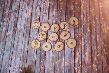happy new year text in snow and retro style on a white wooden background. Winter or Christmas festive concept.