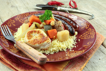 plate of royal couscous with lamb chicken and merguez