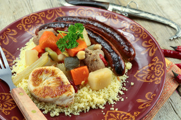 plate of royal couscous with lamb chicken and merguez