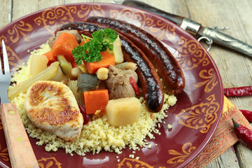 plate of royal couscous with lamb chicken and merguez