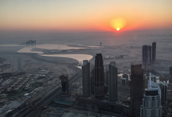 Naklejka na ściany i meble Aerial view of Dubai City at sunrise