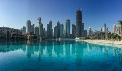Fototapeta na wymiar Tall buildings rising in Dubai, UAE