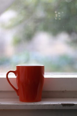 Obraz na płótnie Canvas Cup of tea by the rustic window. Selective focus.