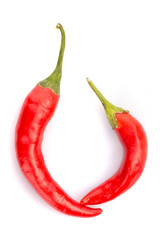 Red chilli peppers isolated on white